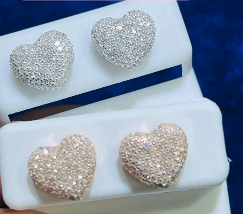 Heart-shaped stud earrings in two visible finishes