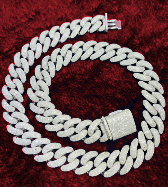 Curb-link jewelry on deep red fabric